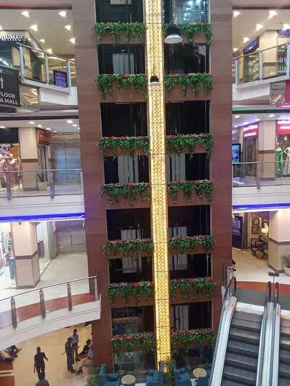 Another view of the mall elevator project, showing the hanging baskets from a different level.