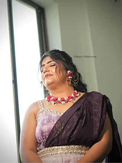 All set for Haldi and Mehendi. The bride looks serene and beautiful with her soft glam makeup and floral jewellery.