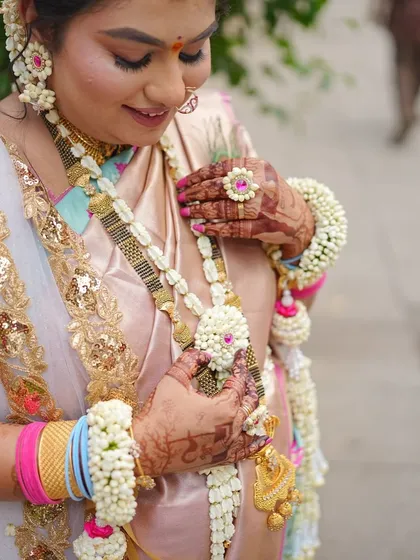 A close-up showing the intricate details of the necklace and haath phool. Each piece is carefully handcrafted to perfection.