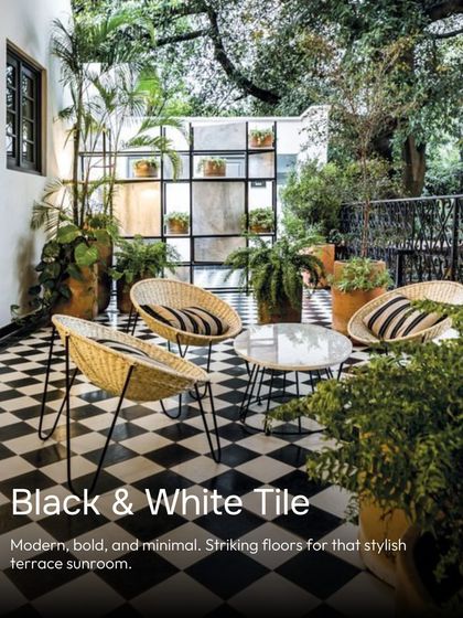 For a modern, bold, and minimal sunroom, you can't go wrong with black and white checkerboard tiles. They create a stylish and striking floor for a terrace or semi-outdoor space.