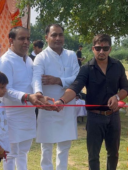 Cutting the ribbon to start a local athletics competition. We actively support and organize events to give athletes a platform.