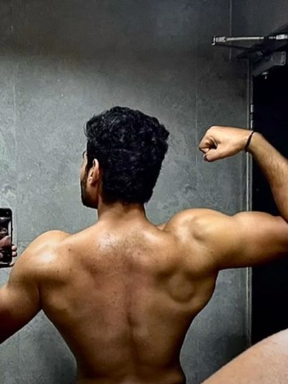 A closer look at the back definition achieved after 6 months of dedicated training and nutrition.