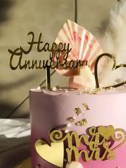 Another view of the anniversary cake, showing the 'Mr & Mrs' topper.