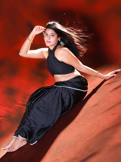 A seated portrait with a dramatic lean. The wind-blown hair and the model's intense gaze make this a very powerful shot.