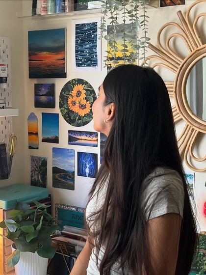 Another photo of me admiring my art wall.