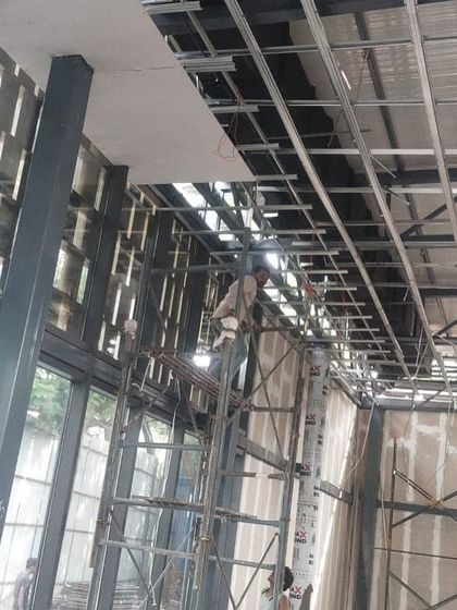 Inside the Experience Center, showing the installation of the ceiling framework. This is the hidden infrastructure that will support lighting and other services.
