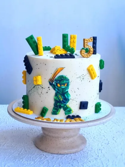 A full view of the Ninjago cake. The design is modern and action-packed, perfect for a little ninja.