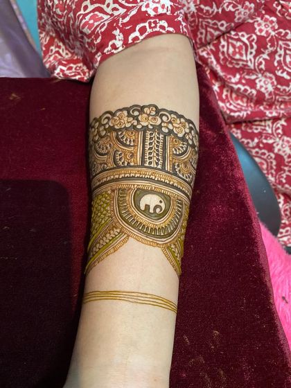 The completed practice band, now featuring a cute elephant motif and intricate fillers.