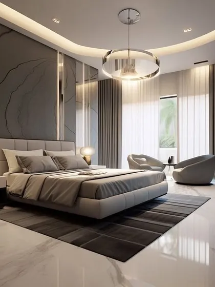 A luxurious master bedroom featuring a marble accent wall, a curved false ceiling with cove lighting, and a modern ring chandelier. The space includes a comfortable seating area by the window, creating a suite-like feel with high-end finishes.