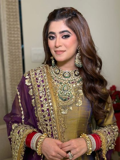 A stunning portrait of the bride-to-be. The smoky eye adds a touch of drama, while the rest of the makeup is kept soft and radiant.