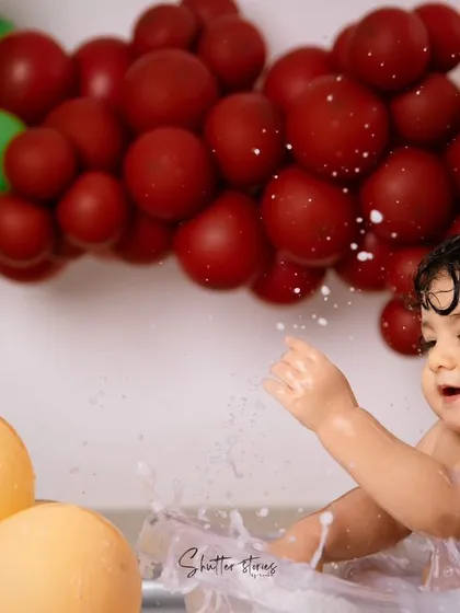 Capturing the action as he joyfully splashes in the water.
