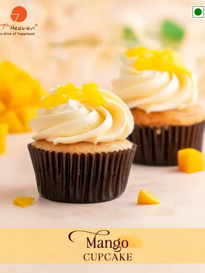 Sunshine in a swirl. Our Mango Cupcake features a light, fluffy sponge topped with a creamy mango-flavored frosting and fresh mango pieces.