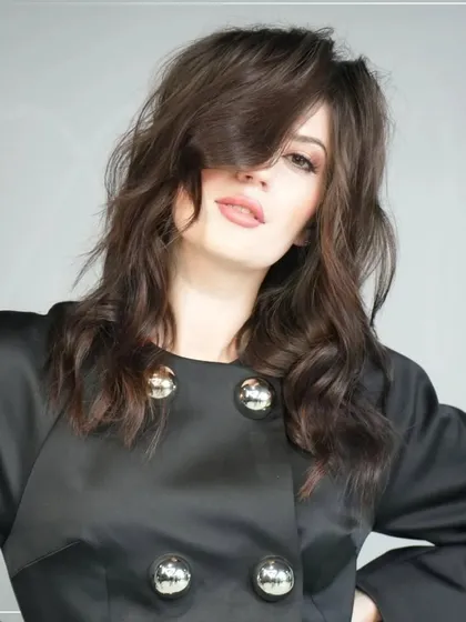 The 'VELAIR' look, created by Jon Wilsdon, is designed for contemporary living. It features dynamic layers and fluid textures that can be styled for either sleek sophistication or airy volume, offering incredible versatility.