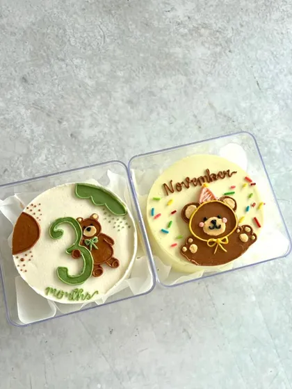 A cute pair of mini bento cakes to celebrate monthly milestones for a baby.