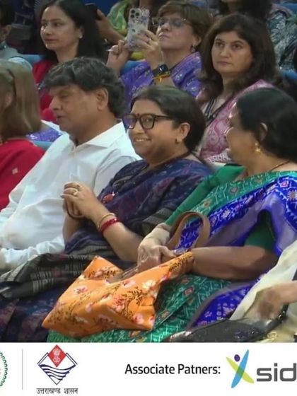 A candid moment from the audience at the Women-Led Development discussions, with Union Minister Smriti Irani in attendance.