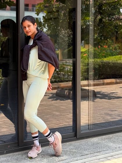 Strong, grounded, and glowing. A moment of stillness and confidence during a photoshoot outside the studio.