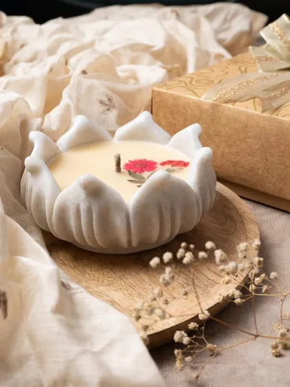 I love the elegance of these marble urli candles. Each one is carved from real Indian marble and filled with scented wax, with delicate pressed flowers on top for a beautiful, lasting gift.
