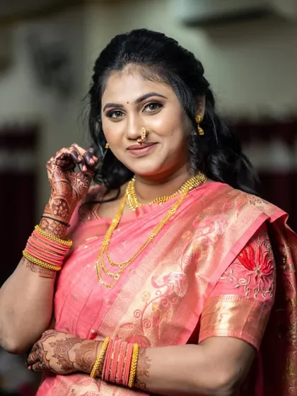 Gauri's engagement look in a lovely pink saree. The makeup is soft and pretty, with a half-up hairstyle that is both elegant and comfortable.