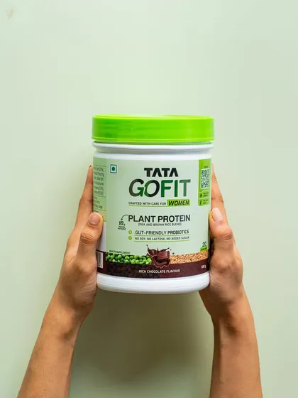 A minimalist, user-focused shot. Hands holding the Tata GoFit product against a clean background puts the focus entirely on the consumer's connection to the brand.