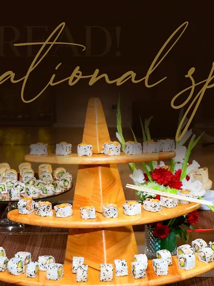 A sensational spread of assorted sushi on a three-tiered wooden stand. We offer a wide variety of rolls to cater to different tastes, including vegetarian and non-vegetarian options.