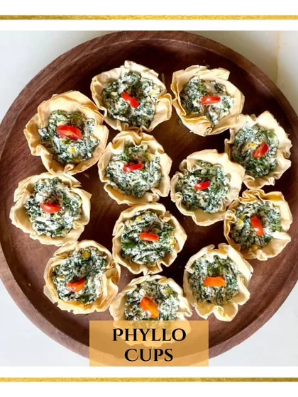 My vegetarian Phyllo Cups are filled with a creamy spinach and ricotta mixture. These crispy, bite-sized cups are an elegant and delicious starter for any party.