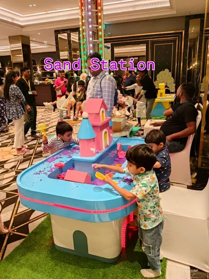 Our Sand Station provides a dedicated space for hands-on, sensory fun. This illuminated table is filled with kinetic sand and includes various molds and tools, allowing children to build and play in a clean, contained environment.