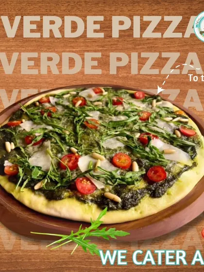 My Verde Pizza is a fresh and flavorful option. It's topped with a vibrant pesto sauce, rocket leaves, cherry tomatoes, and pine nuts for a delicious and unique taste.