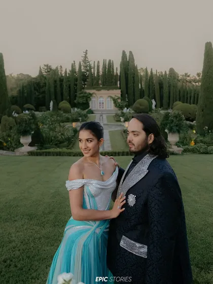 Anant and Radhika's pre-wedding celebration on a Mediterranean cruise, as seen in Vogue. This portrait captures a moment of quiet elegance amidst the grand celebrations, set in a picturesque European garden.
