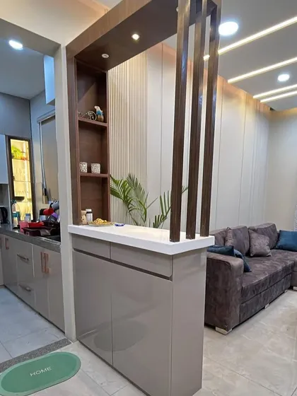 This angle shows how the partition provides both storage and a display area, while maintaining an open feel between the kitchen and living room.