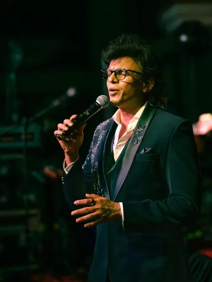 A closer look at Abhijeet Sawant's performance tuxedo, highlighting the detailed sparkle on the lapels and shoulders. It's all about making an impact under the lights.