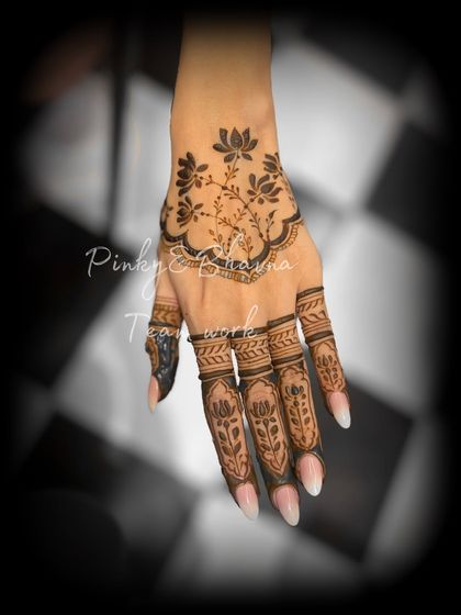 A simple yet stunning back-hand design with a lotus vine. The finger details are kept minimal for an elegant and modern look.