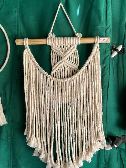 This is a lovely minimalistic wall hanging, about 12 by 18 inches. It's a simple, clean design for anyone who loves the boho but minimal style.