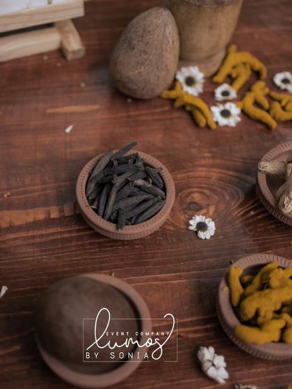 A detailed view of the various spices and herbs used in a traditional Haldi ceremony.