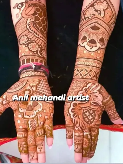 A beautiful example of a traditional design with a mix of motifs. One hand features a prominent peacock, while the other has a classic kalash, both surrounded by detailed filler patterns.