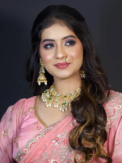 A profile view of the soft glam look, showing the blended eyeshadow and the gentle contouring.