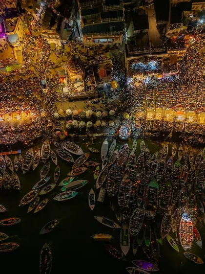 Dev Deepawali in Varanasi, as seen from the night sky. Capturing this festival of lights from above shows the true scale of the celebration, with thousands of diyas and boats creating a divine glow on the Ganga.