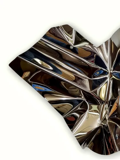 A detail of the sharp, geometric folds within the otherwise organic form of "Meteor 66."