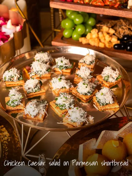 A creative take on a classic salad. This Chicken Caesar Salad is served on a savory Parmesan shortbread, offering a delightful mix of creamy, crunchy, and cheesy in one perfect bite.
