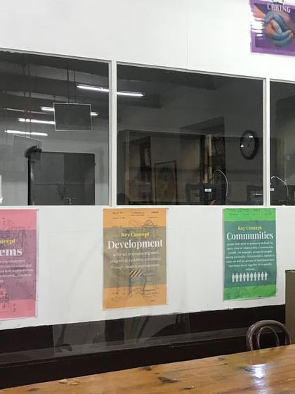 The space before its transformation into a theatre, cluttered with partitions and functioning as a generic lab, its original auditorium character lost.