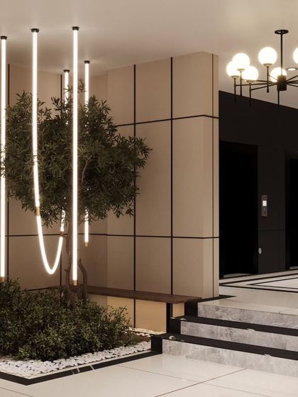 We love incorporating greenery and unique lighting into our designs. This corner of a lobby uses a custom light installation over a small plant bed to create a beautiful and unexpected visual moment.