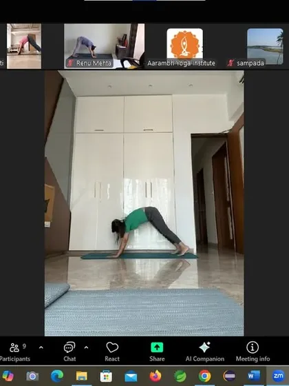 An instructor demonstrates Adho Mukha Svanasana (Downward-Facing Dog) in our online workshop. This foundational yoga pose stretches the entire body, calms the brain, and helps to relieve stress, making it a key part of our holistic weight management program.