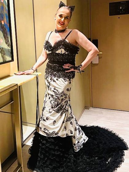 Another shot of the complete look, showing how the cat-ear headband added a playful touch to the elegant black and white gown.