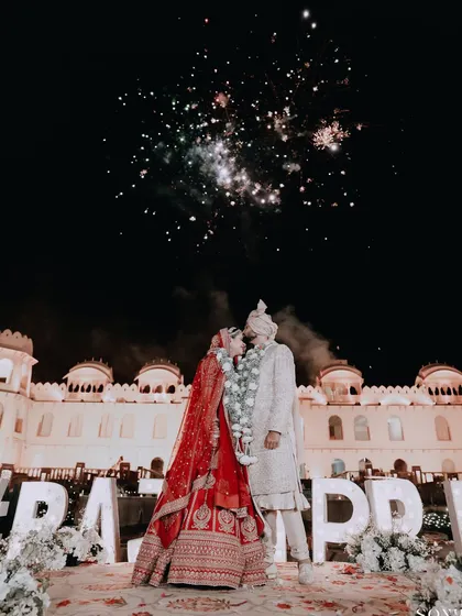 As fireworks light up the sky, two hearts become one. We specialize in capturing the grand scale and explosive joy of your celebrations, turning fleeting moments into epic memories against a palace backdrop.