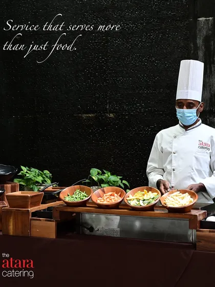 Our service is about more than just food; it's about the people who prepare and serve it with care. A look at one of our professional chefs, ready to cater to your guests' needs at a live pasta station.