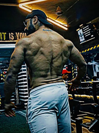 A look at my back definition in the gym. We train for thickness and detail, ensuring your back is as impressive as your front.