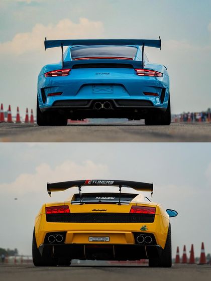 Another look at the iconic Porsche and Lamborghini, two titans of speed ready for battle. The visual appeal of these machines is a huge draw for sponsors and spectators alike.