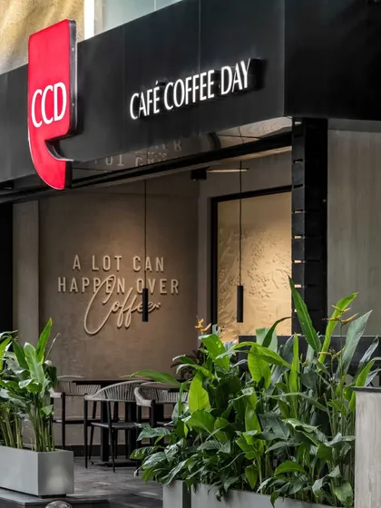 We revitalized the iconic Café Coffee Day on BEL Road by creating an inviting facade that blends modern design with Bangalore's lush greenery. The open, airy entrance is a glimpse into the refreshed, memorable coffee experience we designed within.