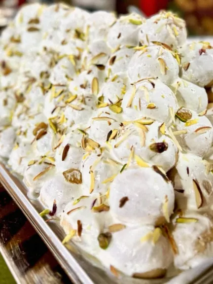 A close up of my Dahi Bhalla, generously topped with creamy yogurt and garnished with slivered almonds and pistachios. It's a rich, refreshing, and utterly delicious chaat.