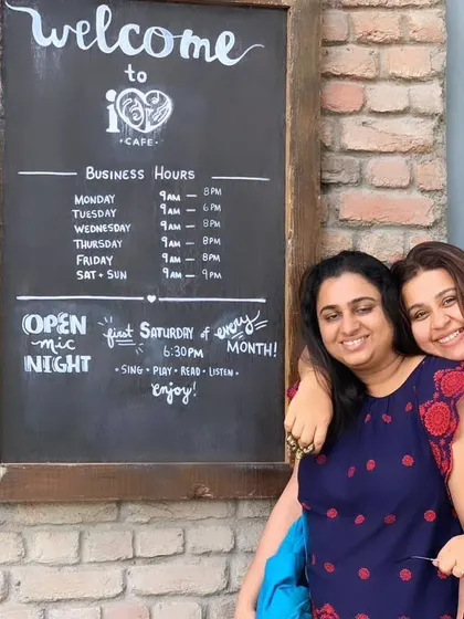 A happy moment captured at a cafe. This photo of our founders reflects the positive and joyful spirit that we bring to every catering experience.