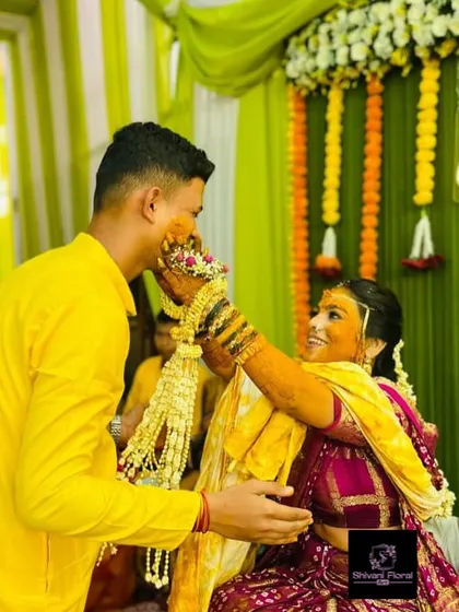 A playful moment from a Haldi ceremony. The bride is wearing my heavy floral kalire, which are not just beautiful but also a fun part of the wedding rituals.